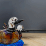 Coppia di Papere, lavorazione a lume senza stampo. Materiale: autentico vetro di Murano e vetro calcedonio, base effetto acqua.