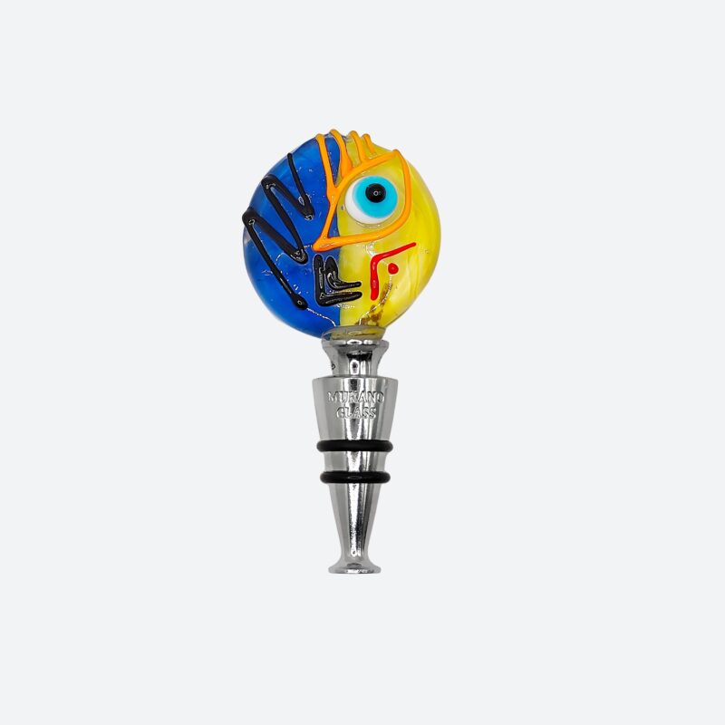 Tappo artistico in vetro di Murano lavorato a lume. Un volto diviso tra sole e notte per dare stile e poesia a ogni bottiglia. Made in Italy.